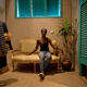 Fashion designer Loza Maleombho sits in the showroom of her clothing line in Abidjan.